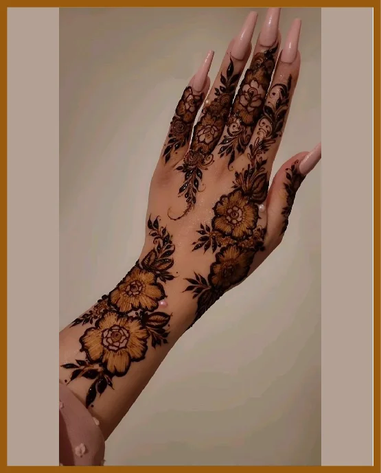 Stylish Back Hand Chain Mehndi Designs With Florals